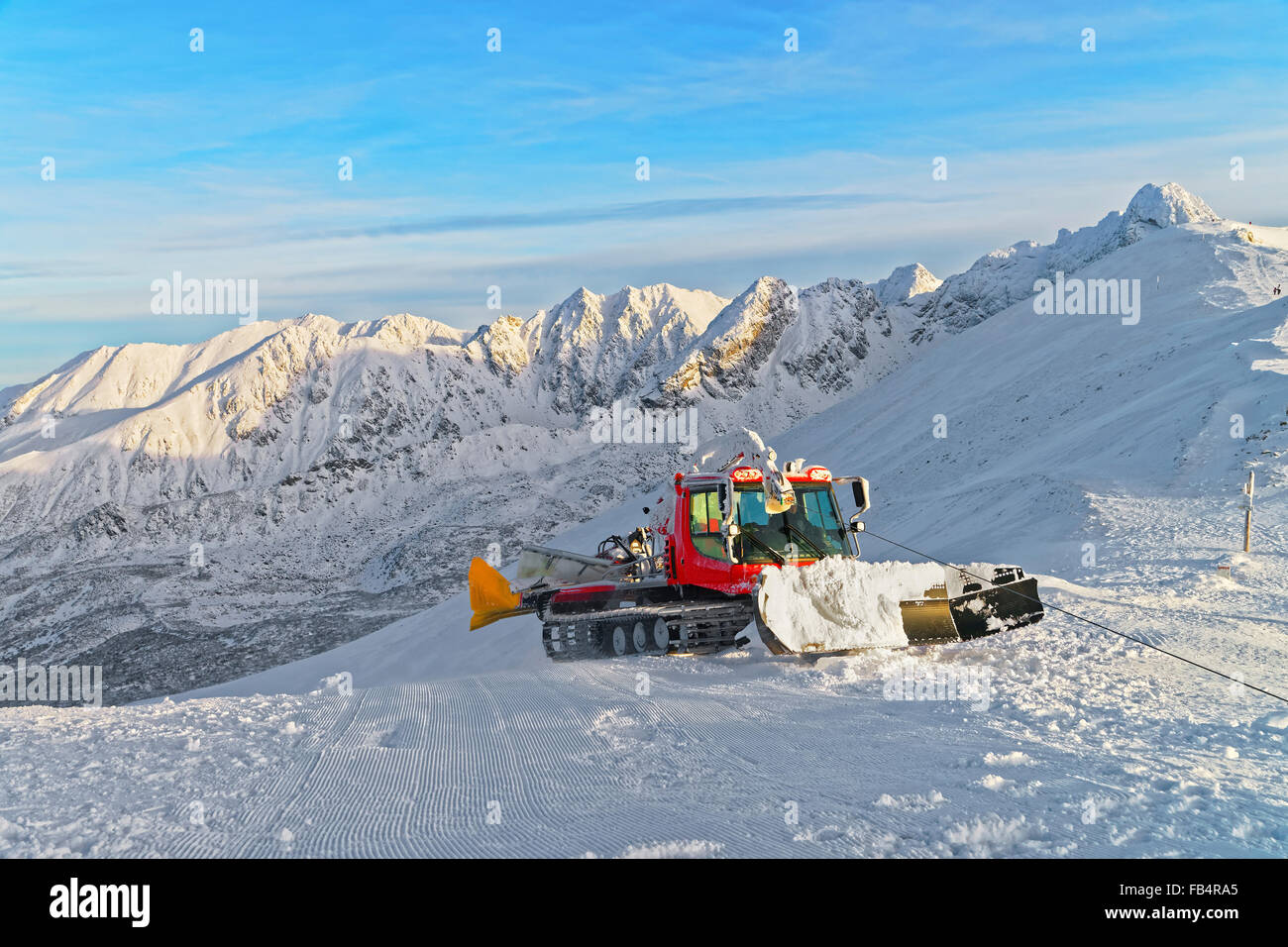 Ratrack at work on Kasprowy Wierch of Zakopane in winter. Zakopane is a town in Poland in Tatra Mountains.Kasprowy Wierch is a mountain in Zakopane and the most popular ski area in Poland Stock Photo