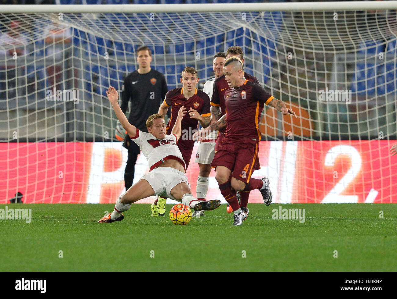 Rome, Italy. 09th Jan, 2016. Keisuke Honda fights for the ball  Radja Nainggolan during the Italian Serie A football match A.S. Roma vs A.C. Milan at the Olympic Stadium in Rome, on january 09, 2016 Credit:  Silvia Lore'/Alamy Live News Stock Photo