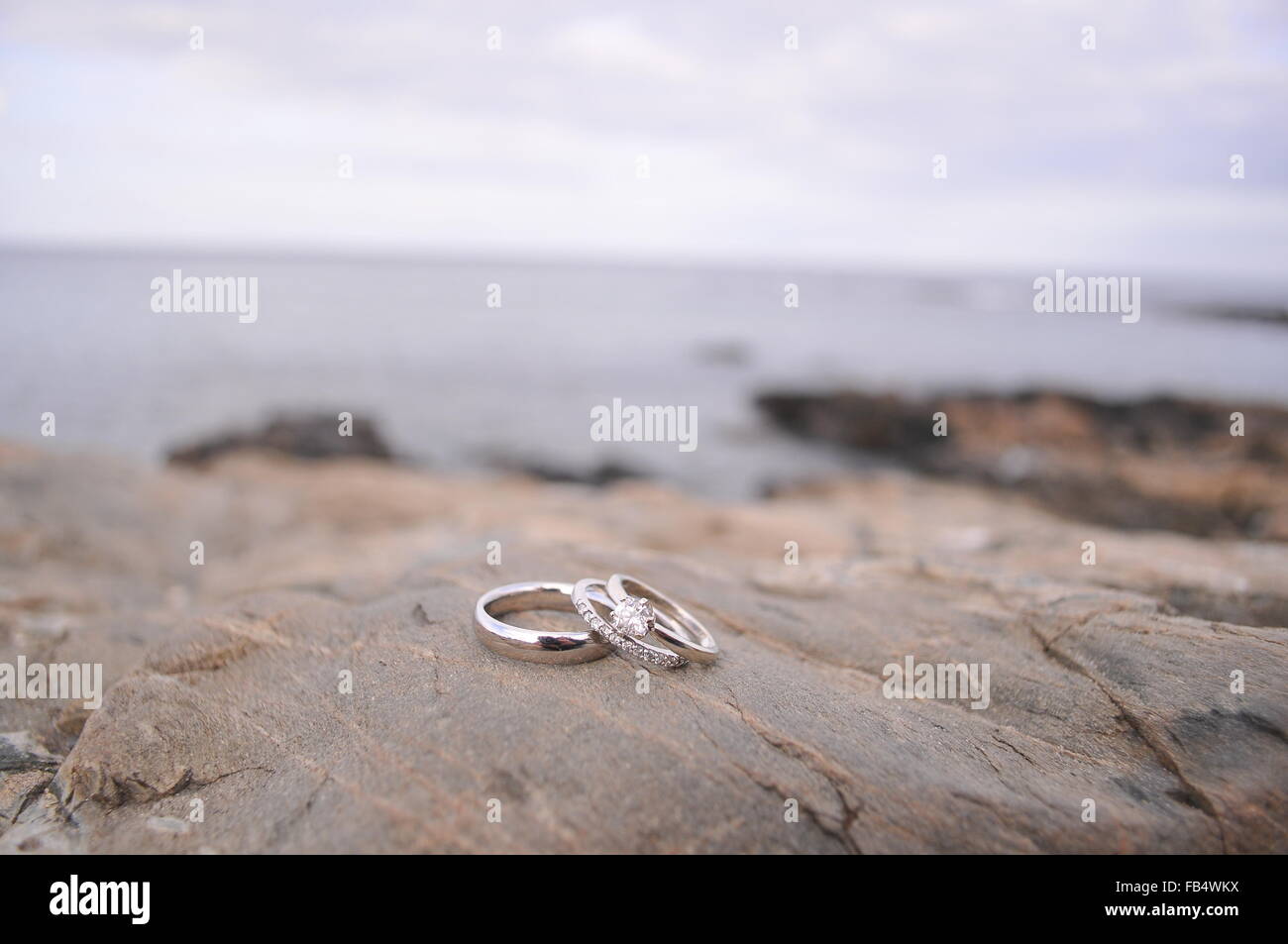 Wedding bands on granite coastline Stock Photo