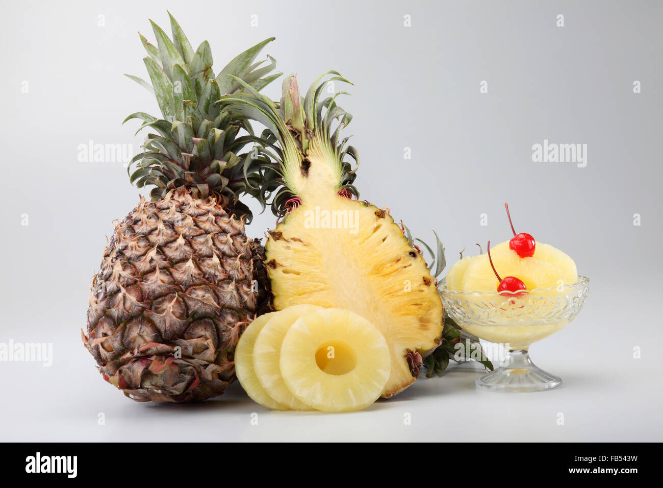 tropical fruit pineapple on the plain background Stock Photo - Alamy