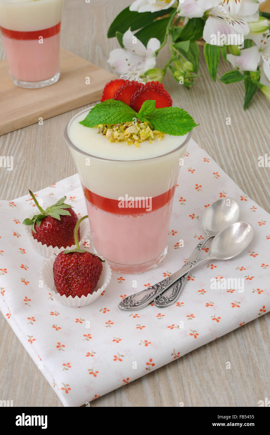 Light and refreshing strawberry yogurt dessert with pistachios Stock