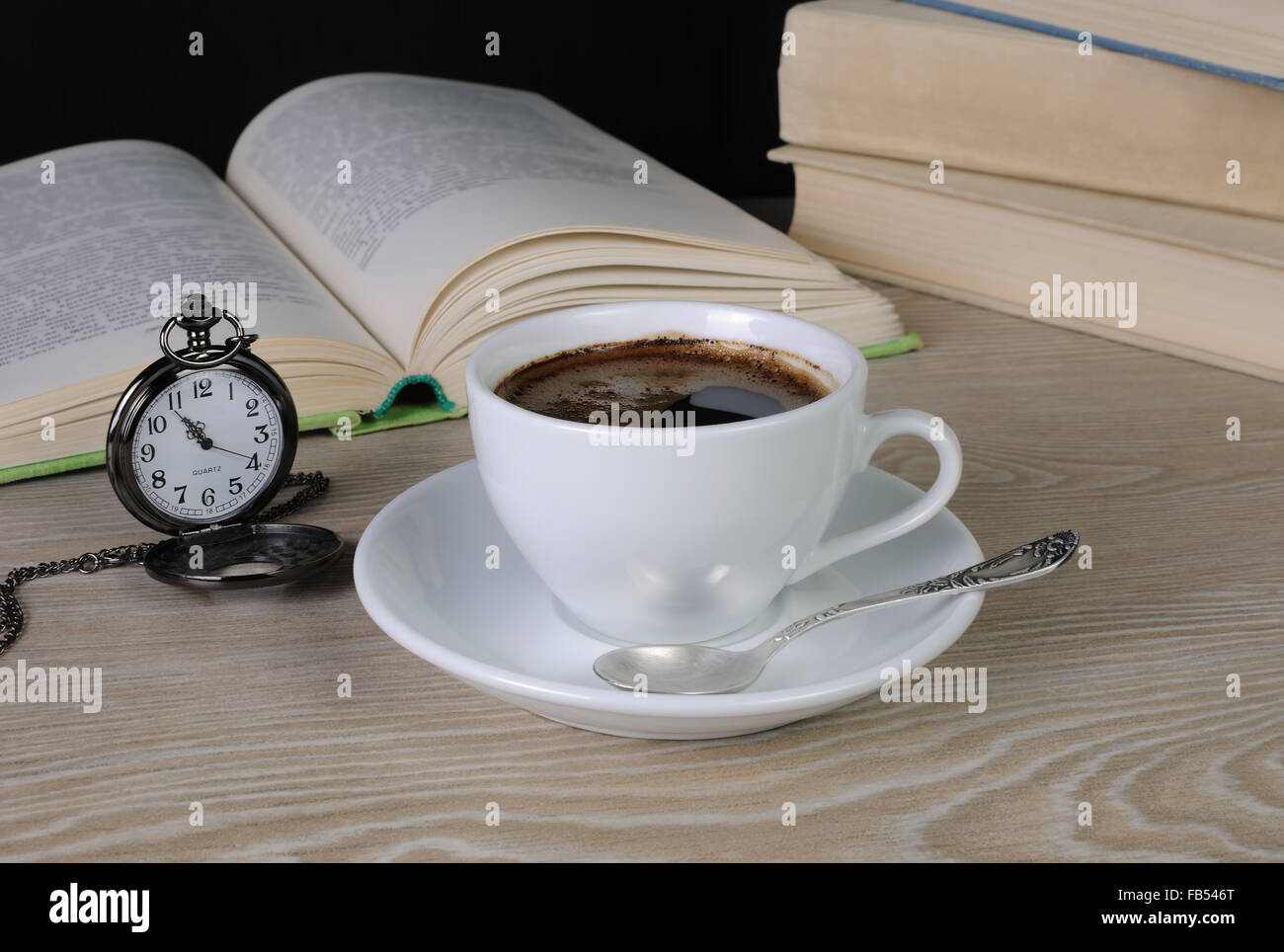 hour to drink a cup of coffee at a table in the library Stock Photo Alamy