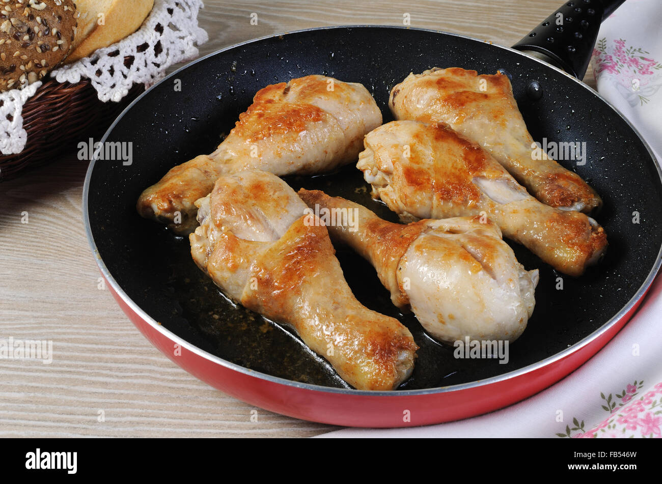 Ruddy fried chicken drumsticks in pan closeup Stock Photo Alamy