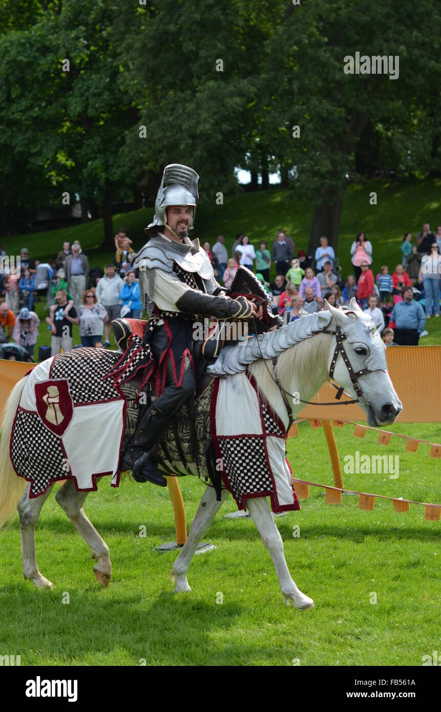 A Medieval knight on horseback at a jousting tournament at Linlithgow Palace, Scotland Stock Photo