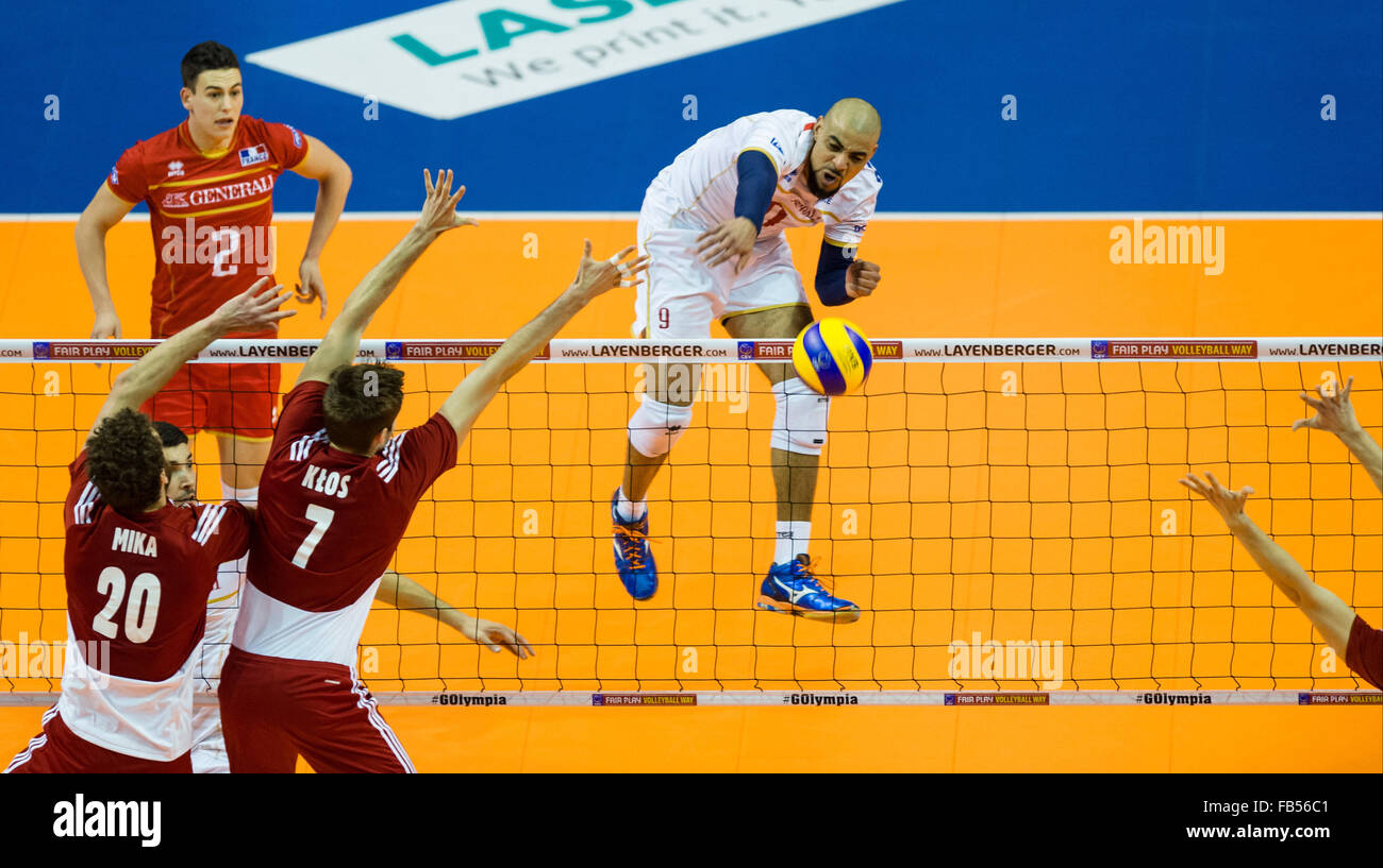 Berlin, Germany. 9th Jan, 2016. France's Earvin Ngapeth (R) and Poland's Mateusz Mika (L) and Karol Klos (2nd L) in action during the men's volleyball Olympic qualifier France vs Poland in Berlin, Germany, 9 January 2016. Photo: Gregor Fischer/dpa/Alamy Live News Stock Photo