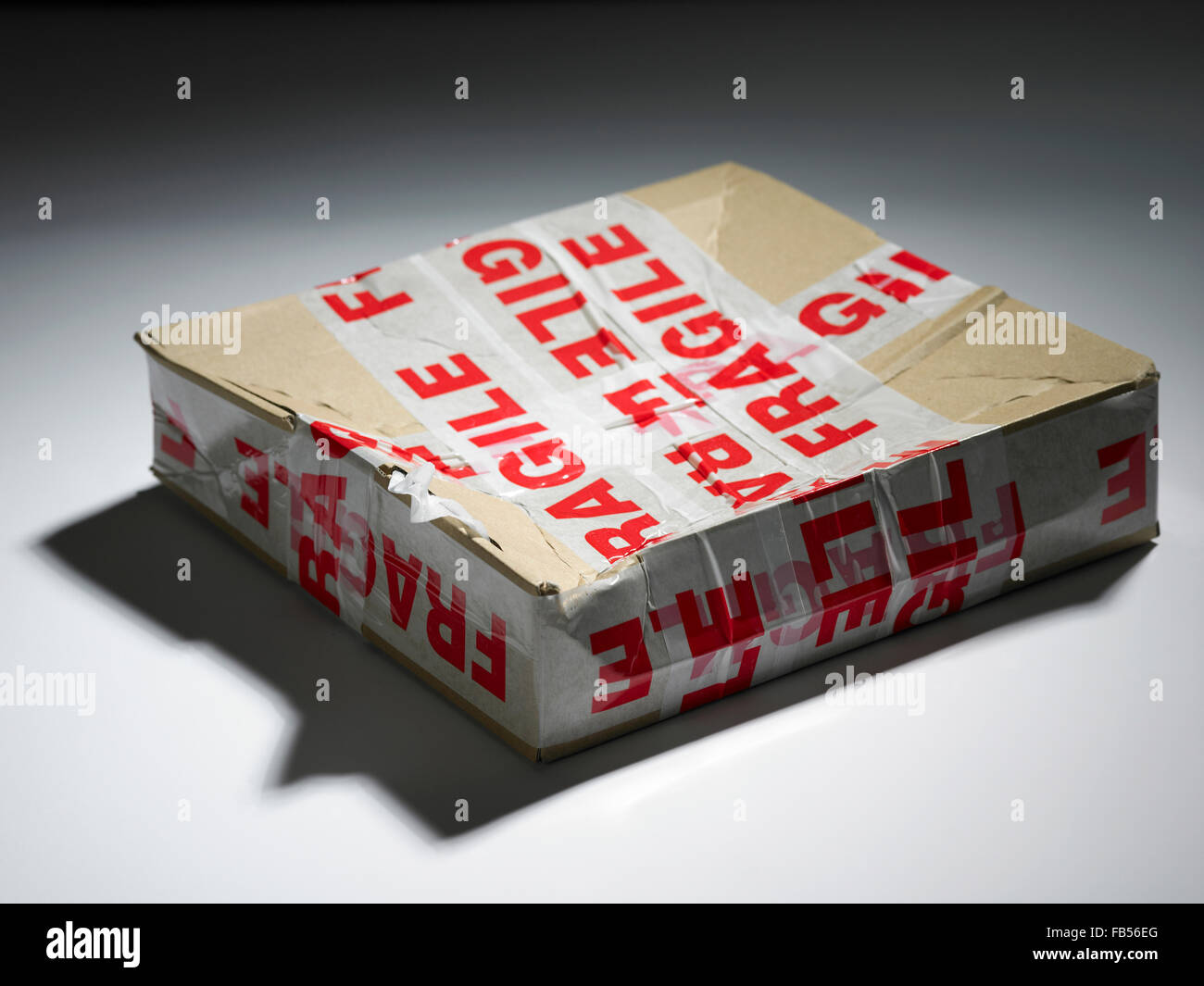 a damaged box with the fragile sticker on it Stock Photo Alamy