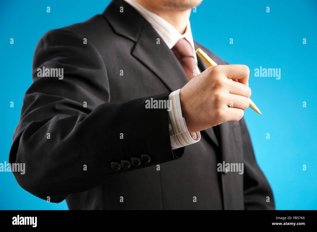 man holding a pen Stock Photo - Alamy