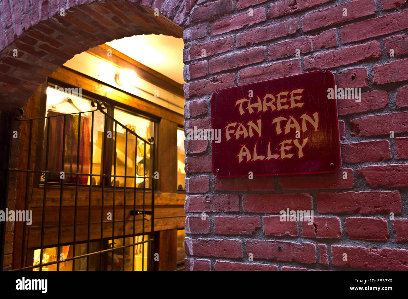 Brick wall and shop entrance in Fan Tan Alley, in Chinatown, Victoria, BC, Canada Stock Photo