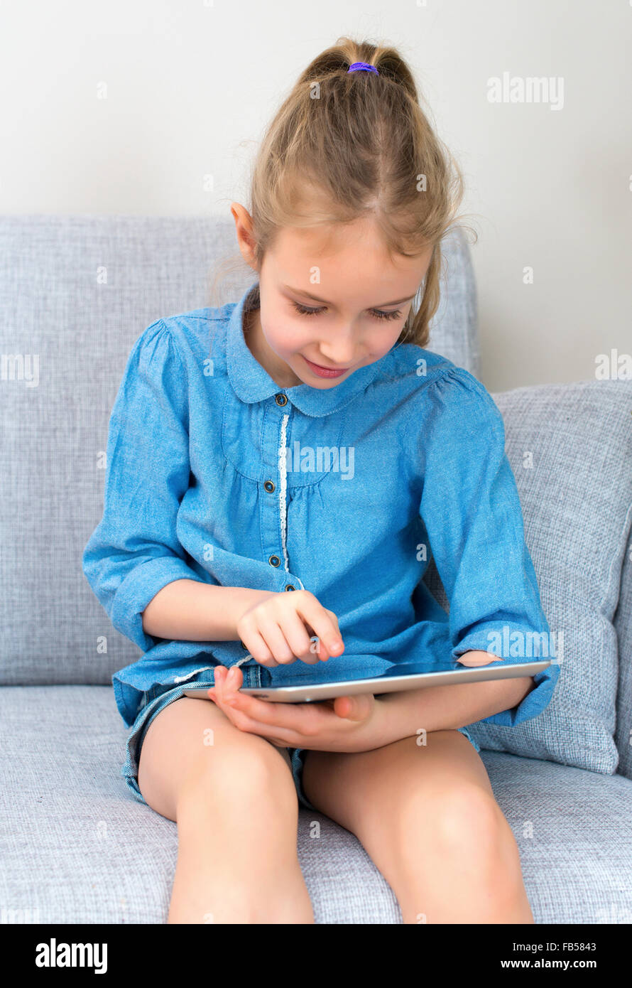 Little girl sofa hi-res stock photography and images - Alamy