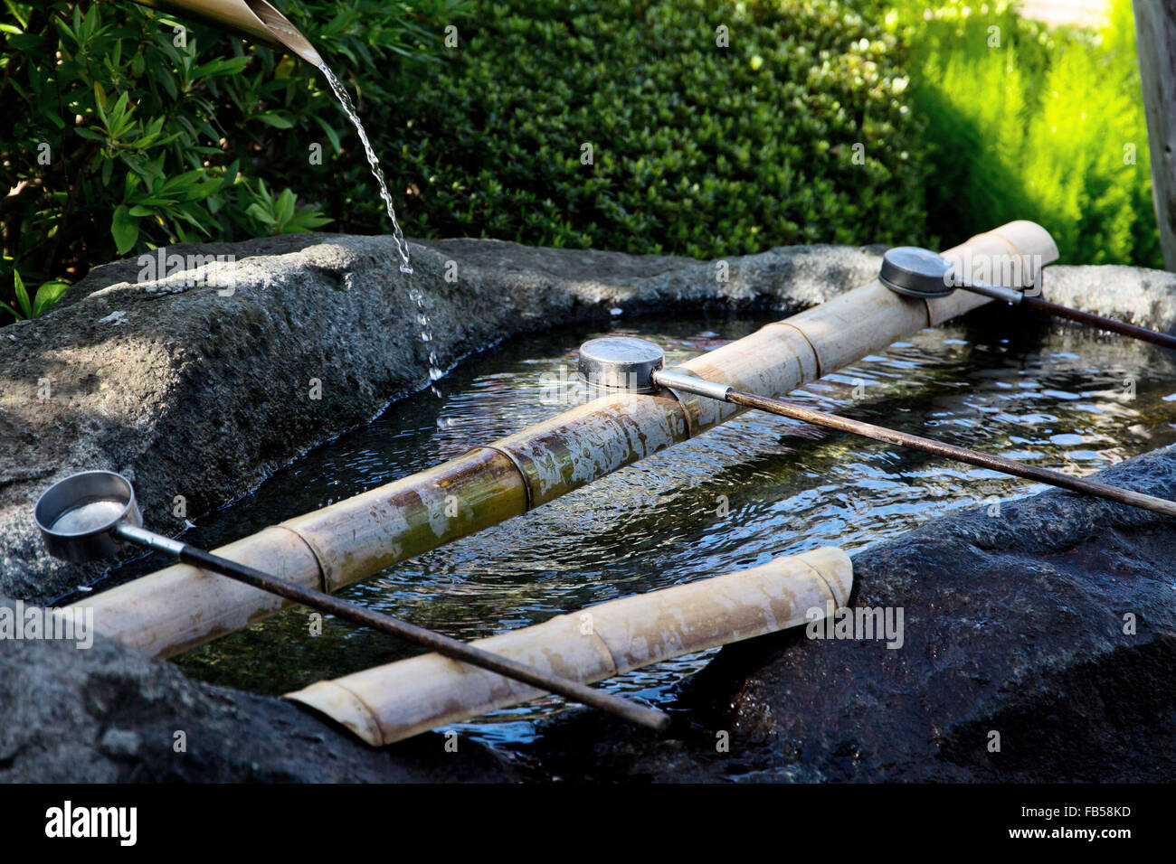 Japanese water source and ladle for the purification of hands Stock