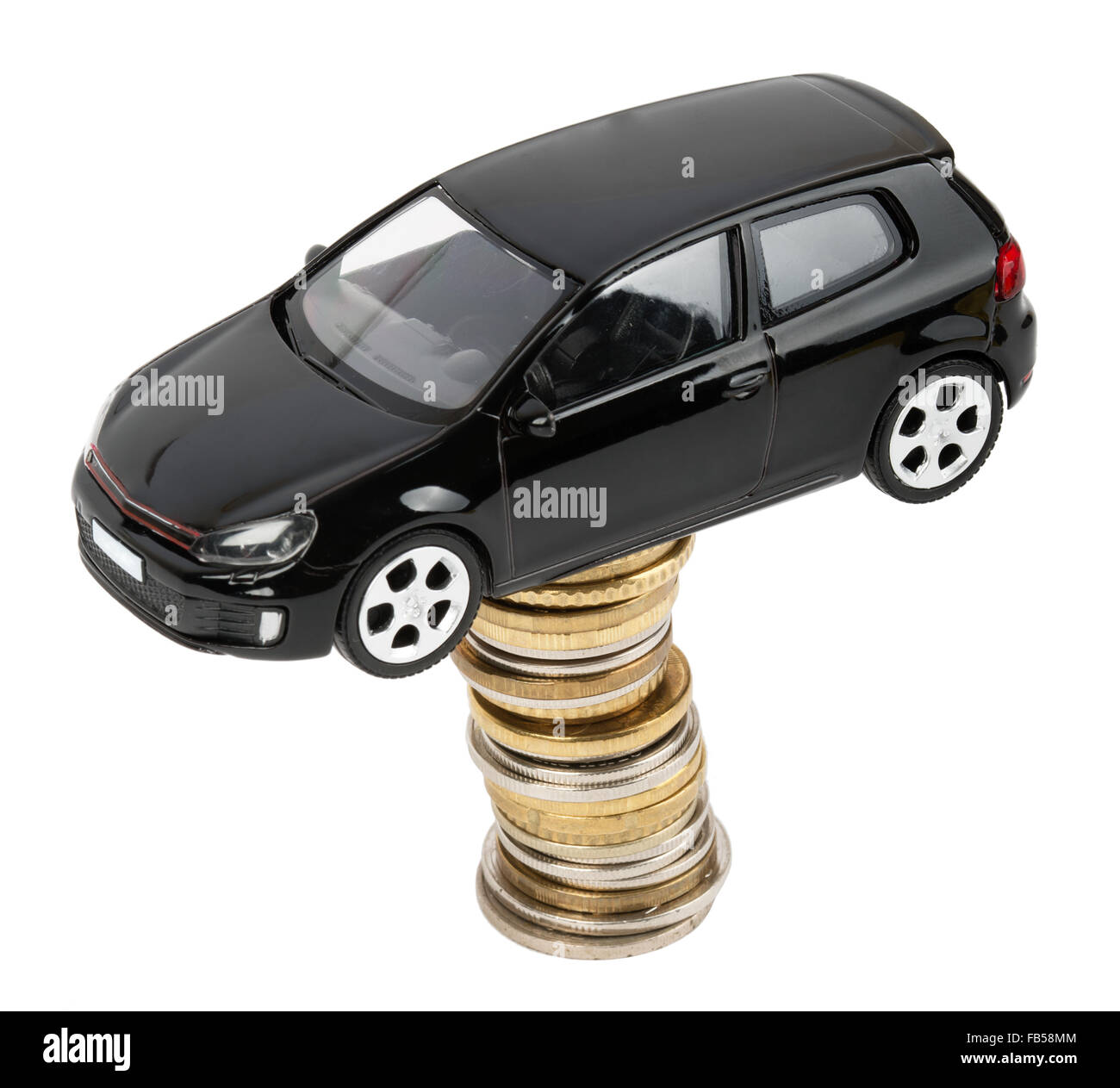 Car on stack of coins Stock Photo Alamy