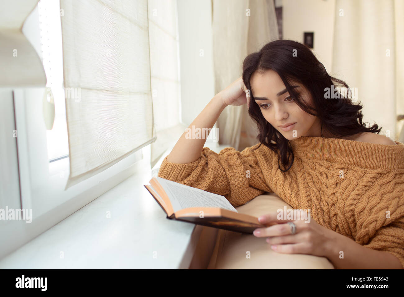 Beautiful young woman at home Stock Photo - Alamy