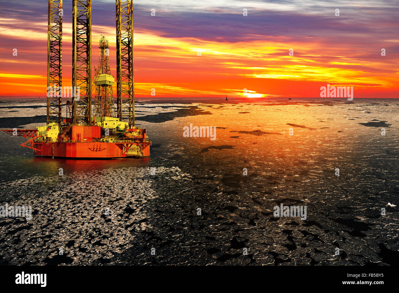 Offshore oil and rig platform in sunrise on frozen sea. Stock Photo