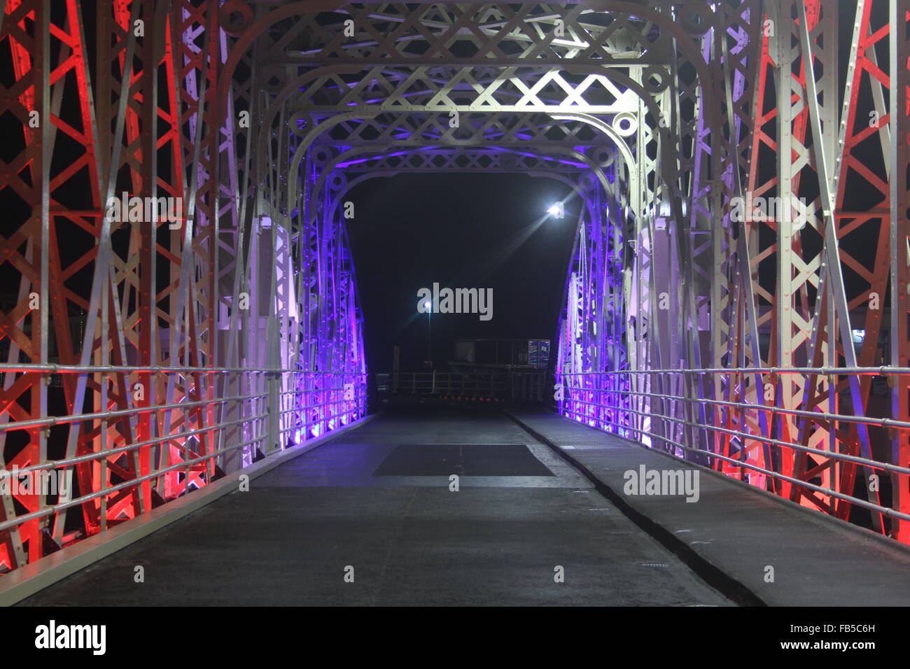 Looking through the ironwork of the Ramsey Swing Bridge, Ramsey Harbour, Ramsey, Isle of Man. Stock Photo