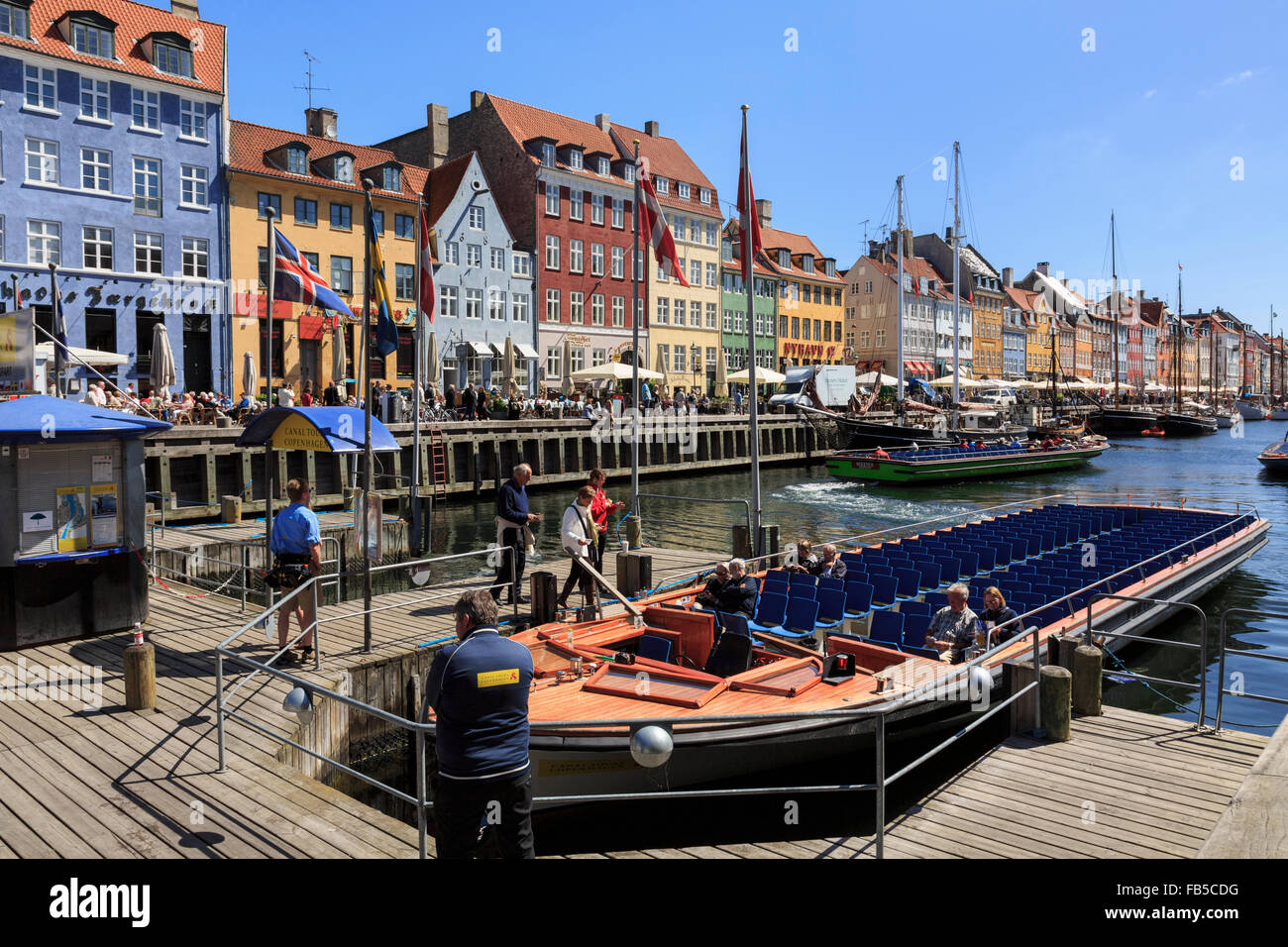 Tourists boat for canal tours in Nyhavn, Copenhagen, Zealand, Denmark, Scandinavia, Europe Stock Photo