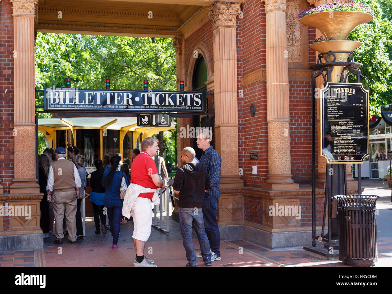 People buying tickets from Ticket Office at entrance gate to Tivoli Gardens amusement park. Copenhagen, Denmark, Scandinavia Stock Photo