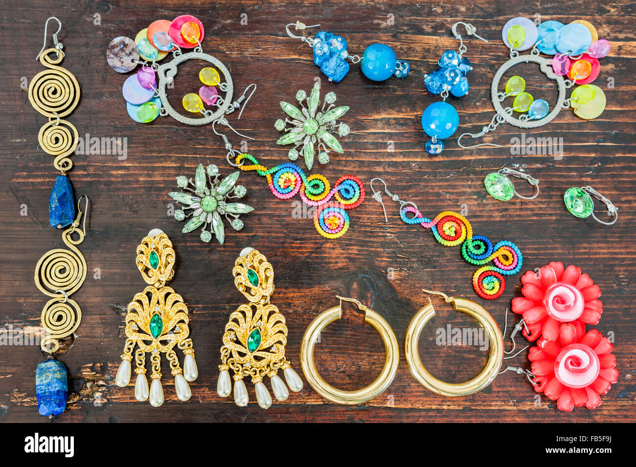 Women's jewelry. Various types of earrings very colorful. Stock Photo