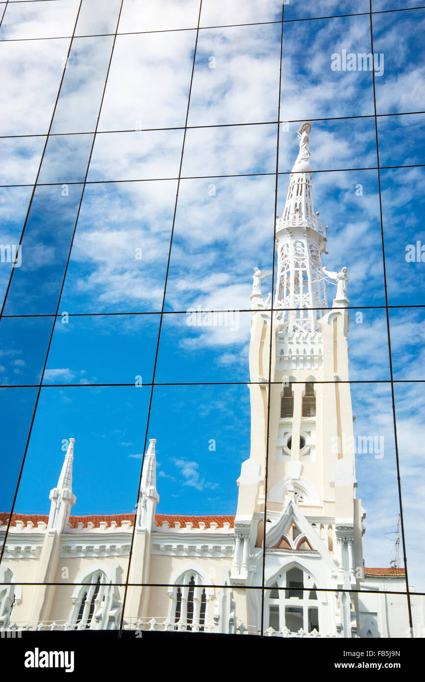 La Concepcion church reflected on glass facade. Goya street, Madrid, Spain. Stock Photo