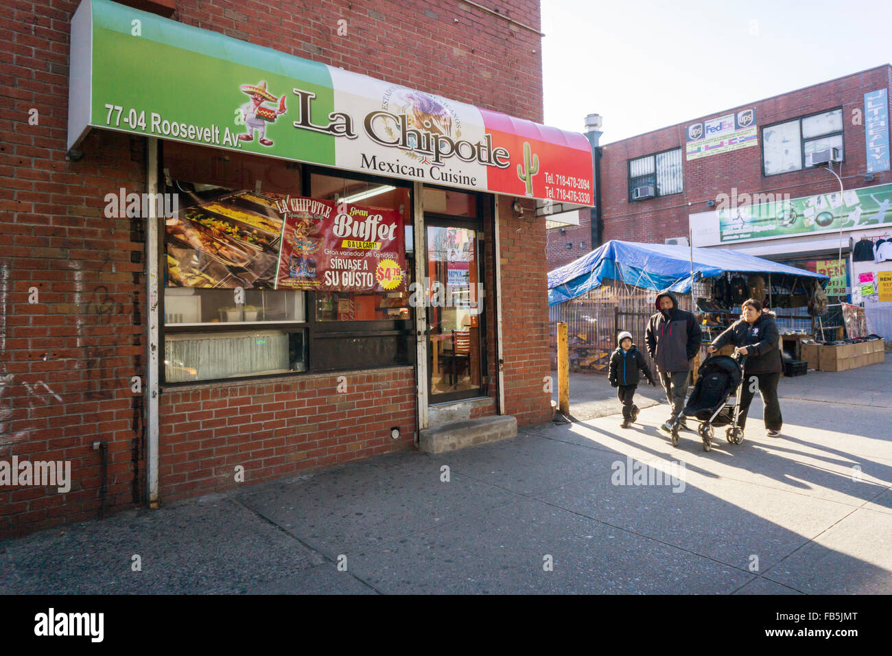 La Chipotle Mexican restaurant under the elevated Number 7 train in the Jackson Heights neighborhood in Queens in New York on Sunday, January 3, 2016. The Jackson Heights neighborhood is home to a mosaic of ethnic groups. (© Richard B. Levine) Stock Photo