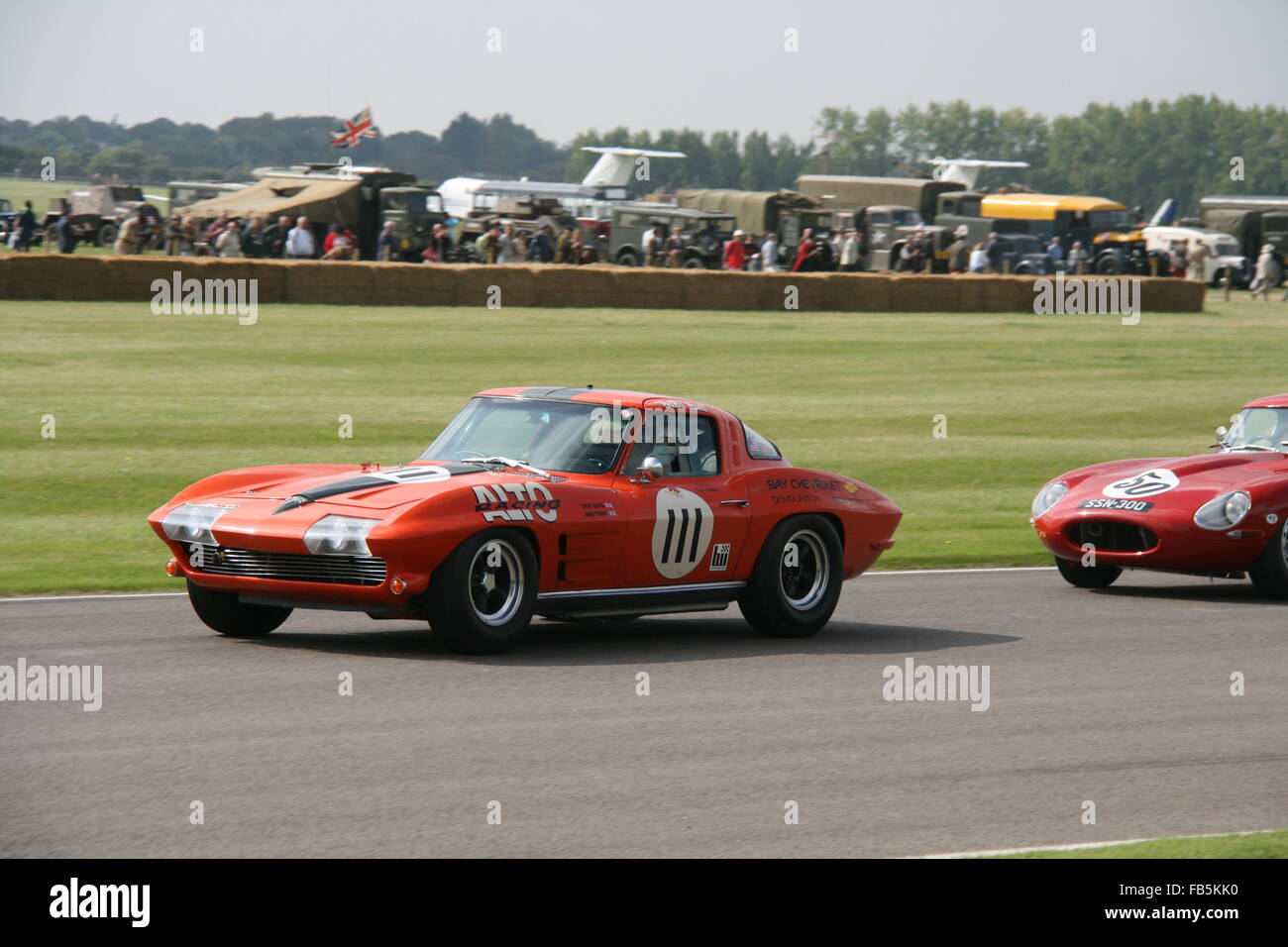 TWO RED CLASSIC RACING CARS AT GOODWOOD REVIVAL IN UK Stock Photo