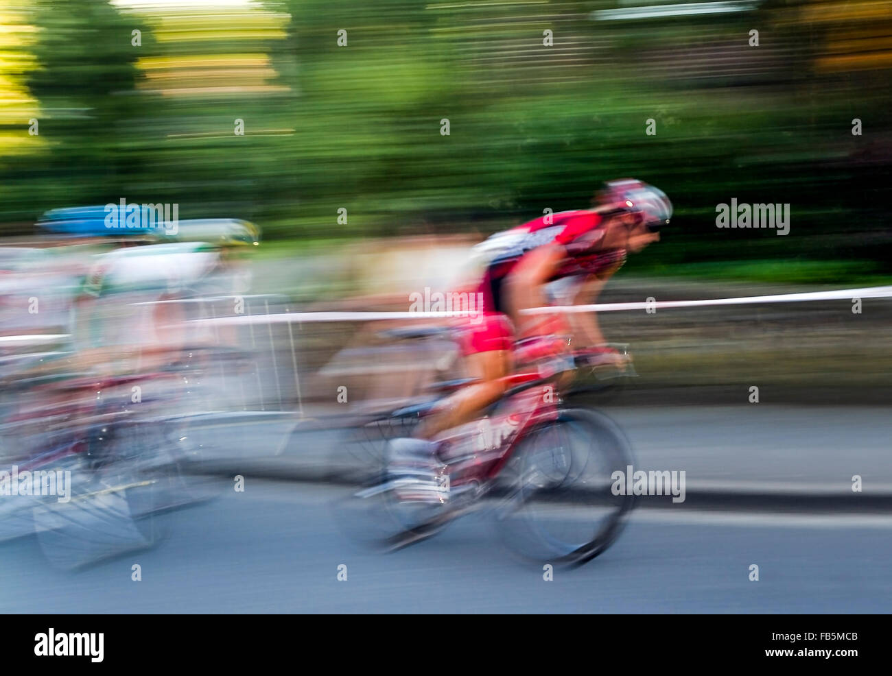 Bicyclist blurred Stock Photo - Alamy