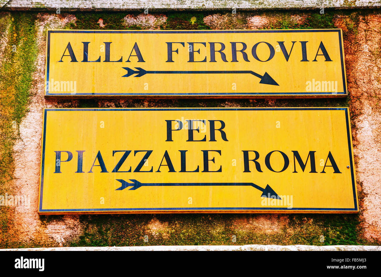 Alla Ferrovia and Piazzale Roma direction sign in Venice, Italy Stock Photo