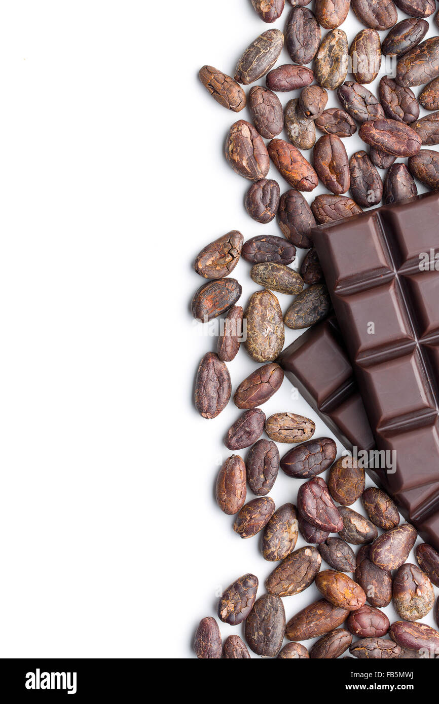 dark chocolate bars and cocoa beans on white background Stock Photo