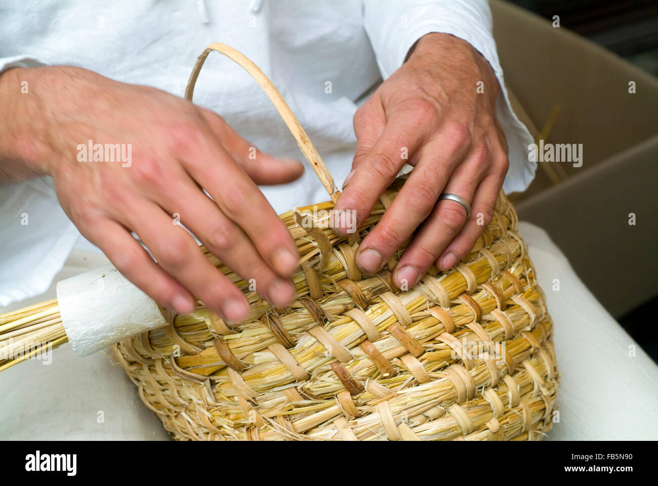 Beekeeper is building a historic beehive Stock Photo