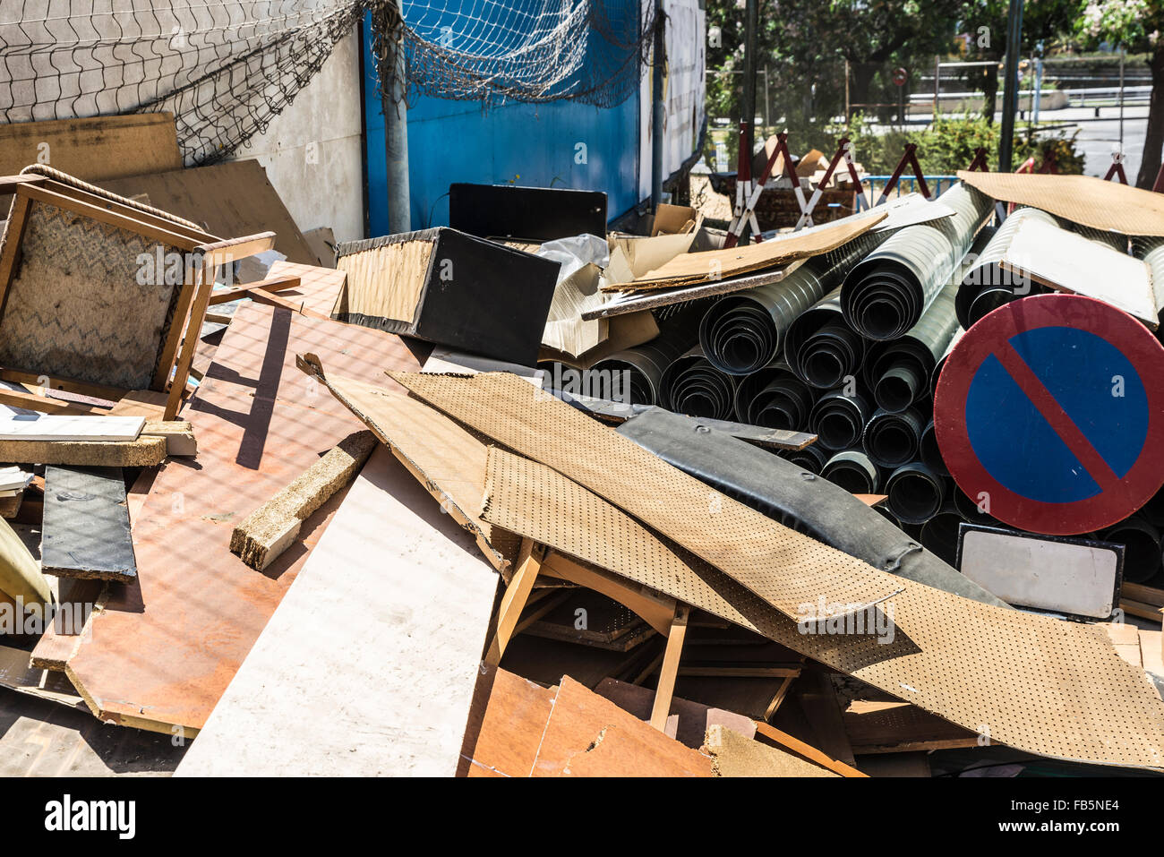 Lots of old wood, chairs, road sign, planks and rubble Stock Photo