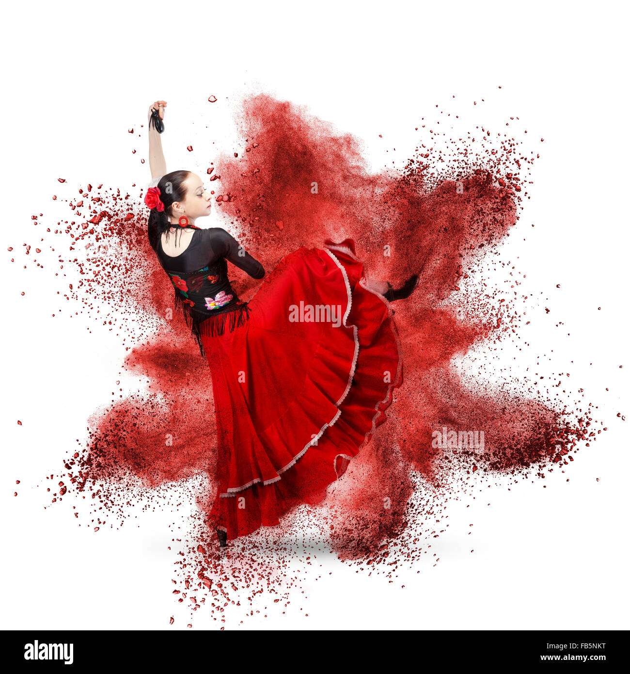 young woman dancing flamenco with against explosion isolated