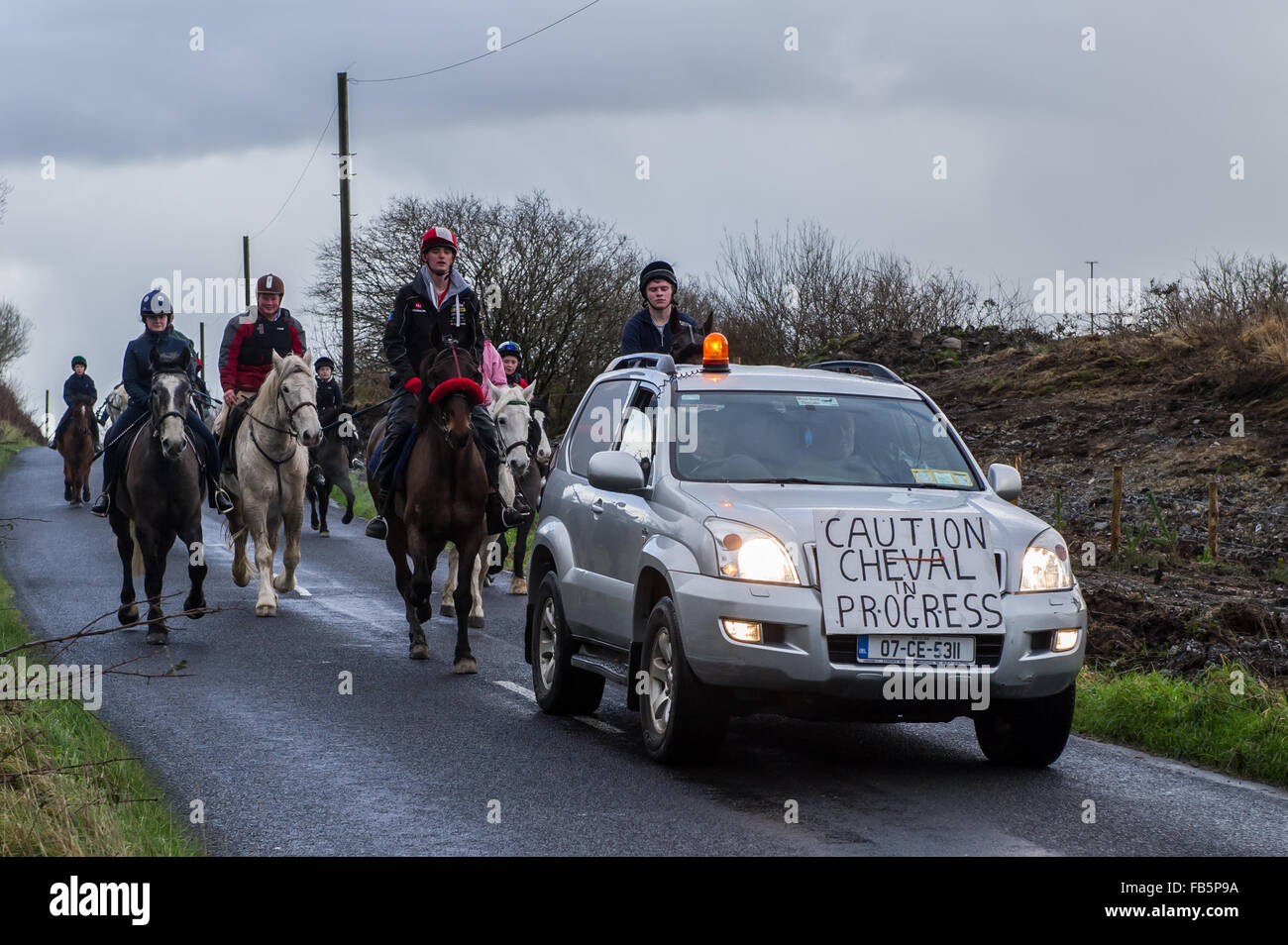 Drimoleague, Ireland. 10th January, 2016. The safety car heads up the horse riders during the Drimoleague to Drinagh Cheval. The Cheval was held to raise funds for COPE Foundation. Credit: Andy Gibson/Alamy Live News Stock Photo