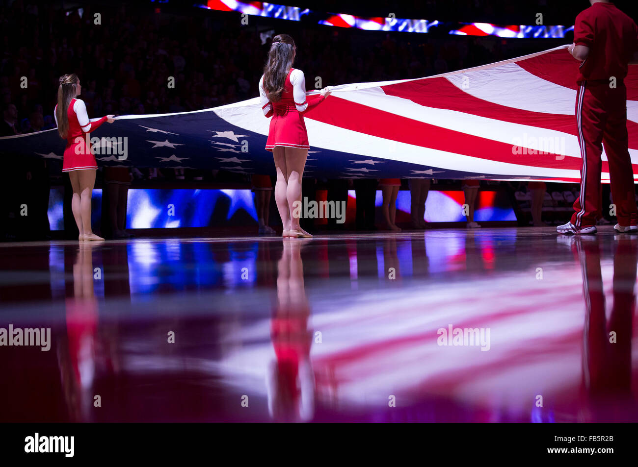 Madison, WI, USA. 9th Jan, 2016. Wisconsin cheerleaders hold the American flag during the National Anthem prior to the NCAA Basketball game between the Maryland Terrapins and the Wisconsin Badgers at the Kohl Center in Madison, WI. Maryland defeated Wisconsin 63-60. John Fisher/CSM/Alamy Live News Stock Photo