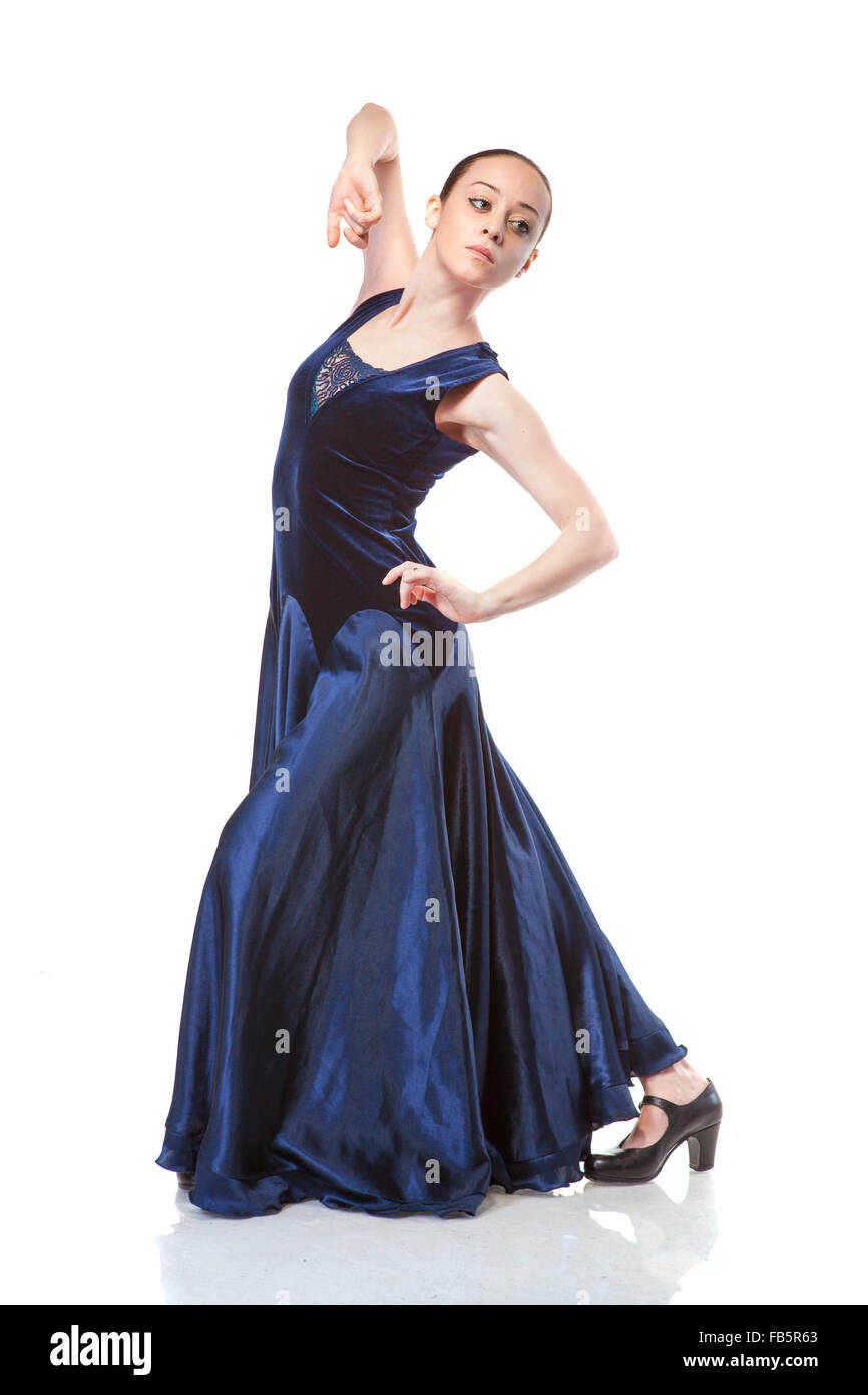 young woman dancing flamenco in blue dress isolated on white background
