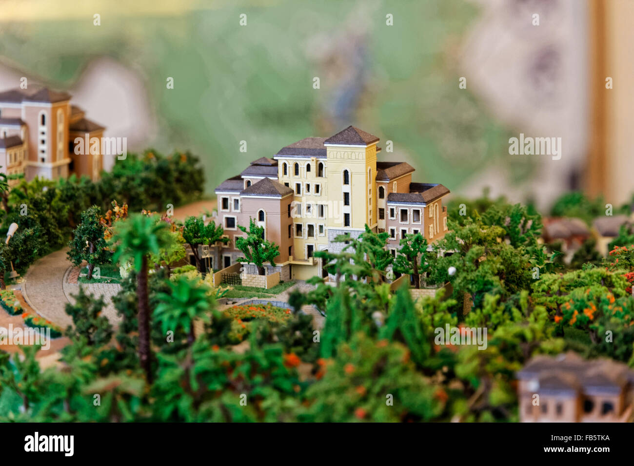 Small toy house on a hill surrounded by greenery Stock Photo Alamy