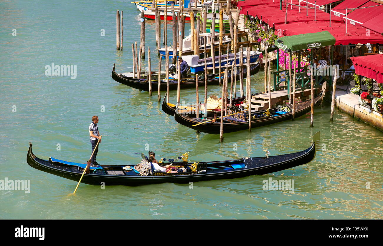 Venice - tourists in gondola, Grand Canal, Venice, Italy, UNESCO Stock Photo