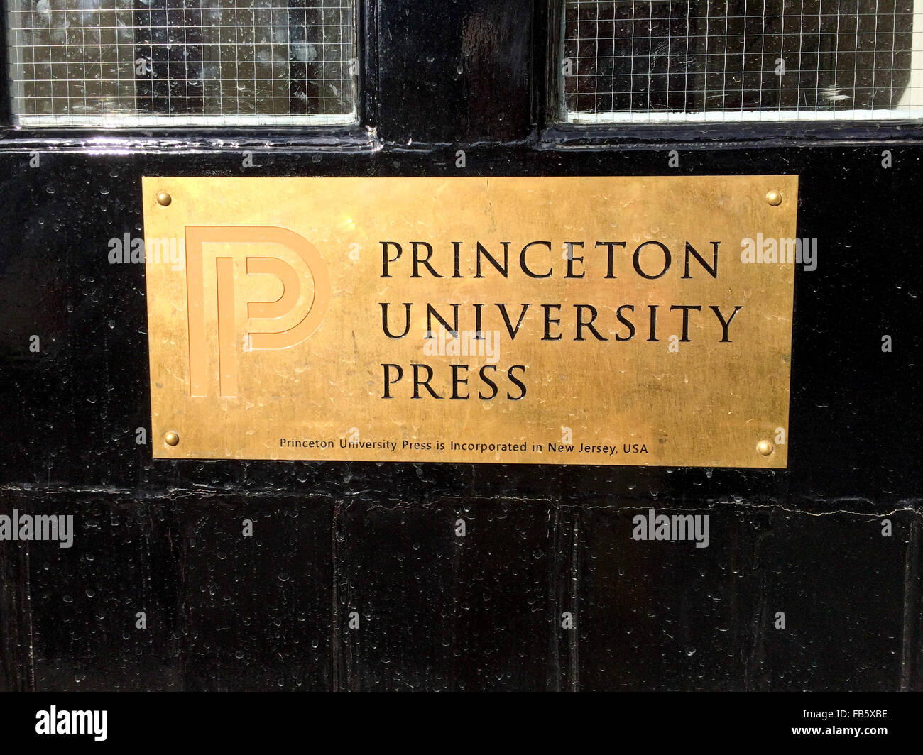 Front door with gold plaque of Princeton University Press office in  Woodstock, UK Stock Photo - Alamy