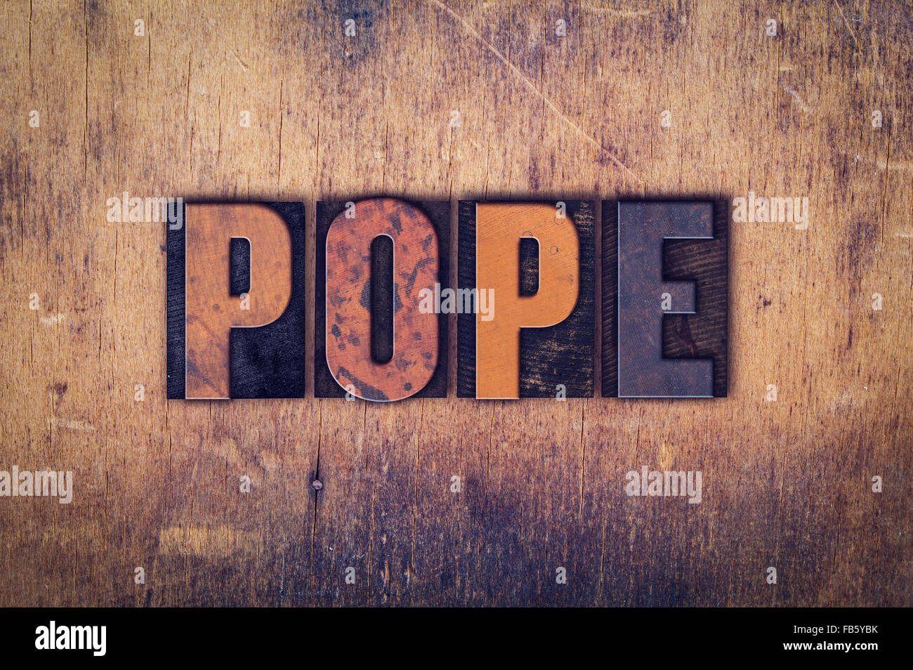 The word "Pope" written in dirty vintage letterpress type on a aged