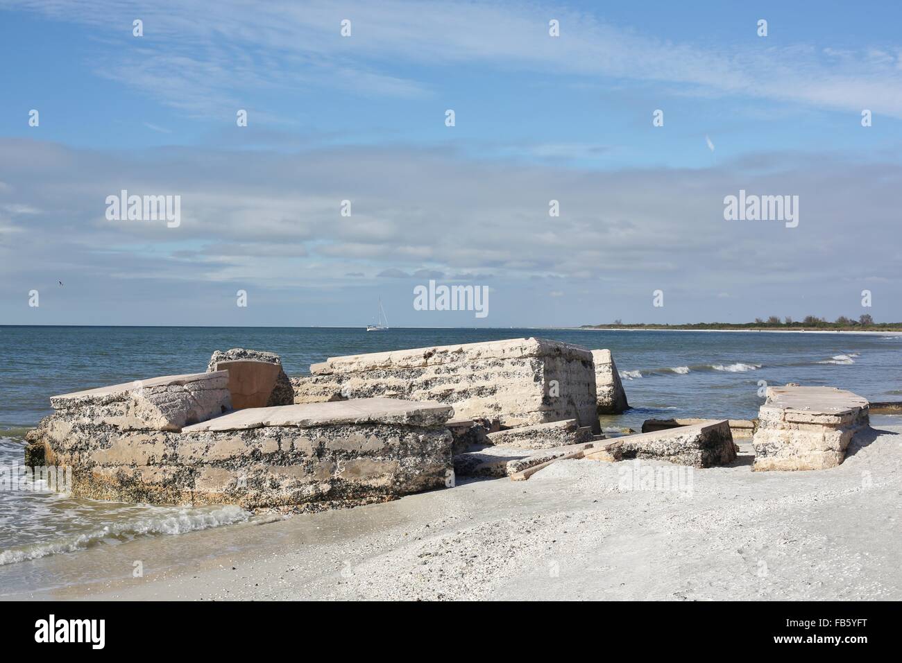 Ruins crumbling into the ocean at Fort Desoto in St. Petersburg, Florida. Stock Photo