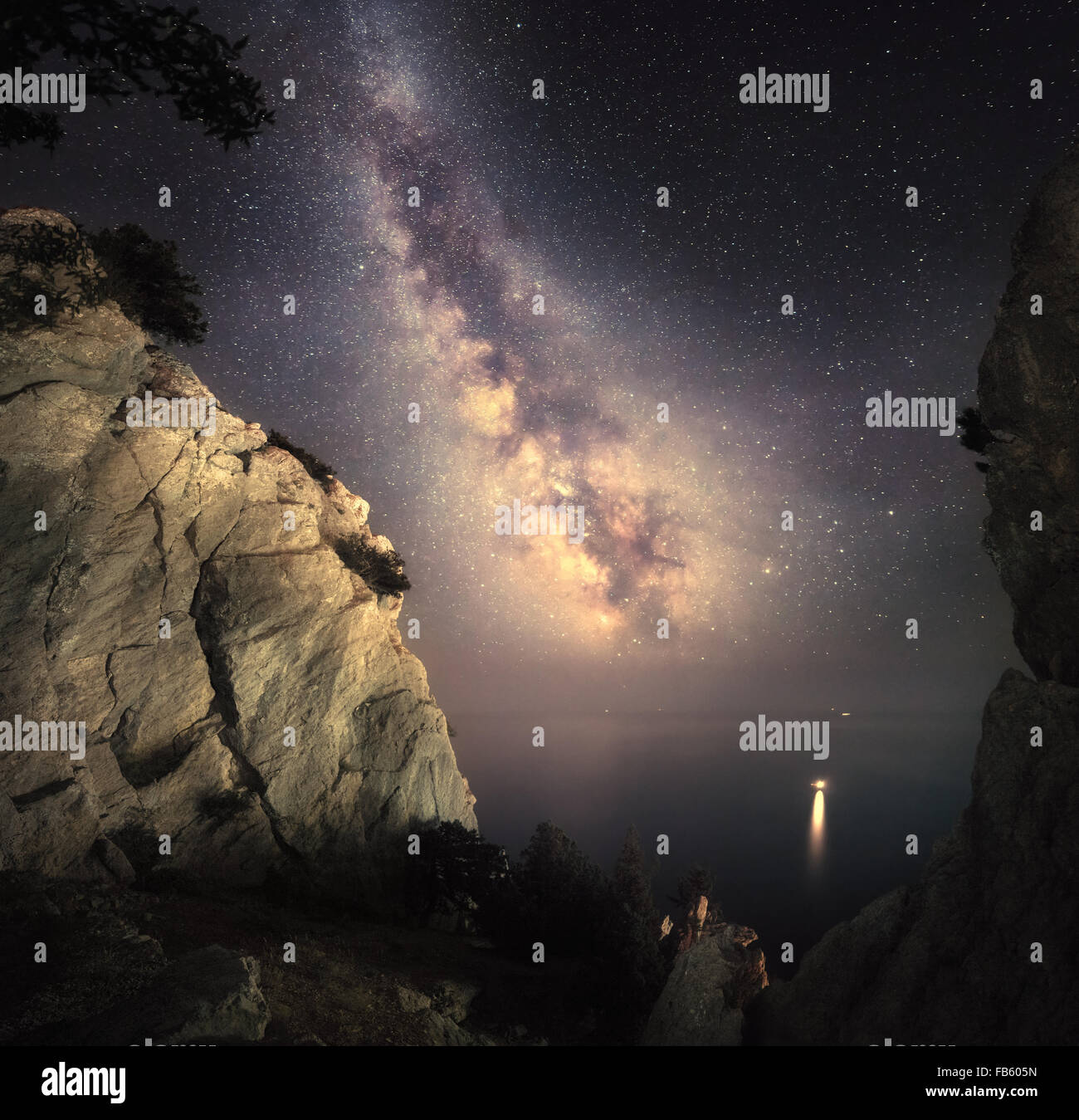 Milky Way. Beautiful night landscape with rocks, sea and starry sky. Nature Background Stock Photo