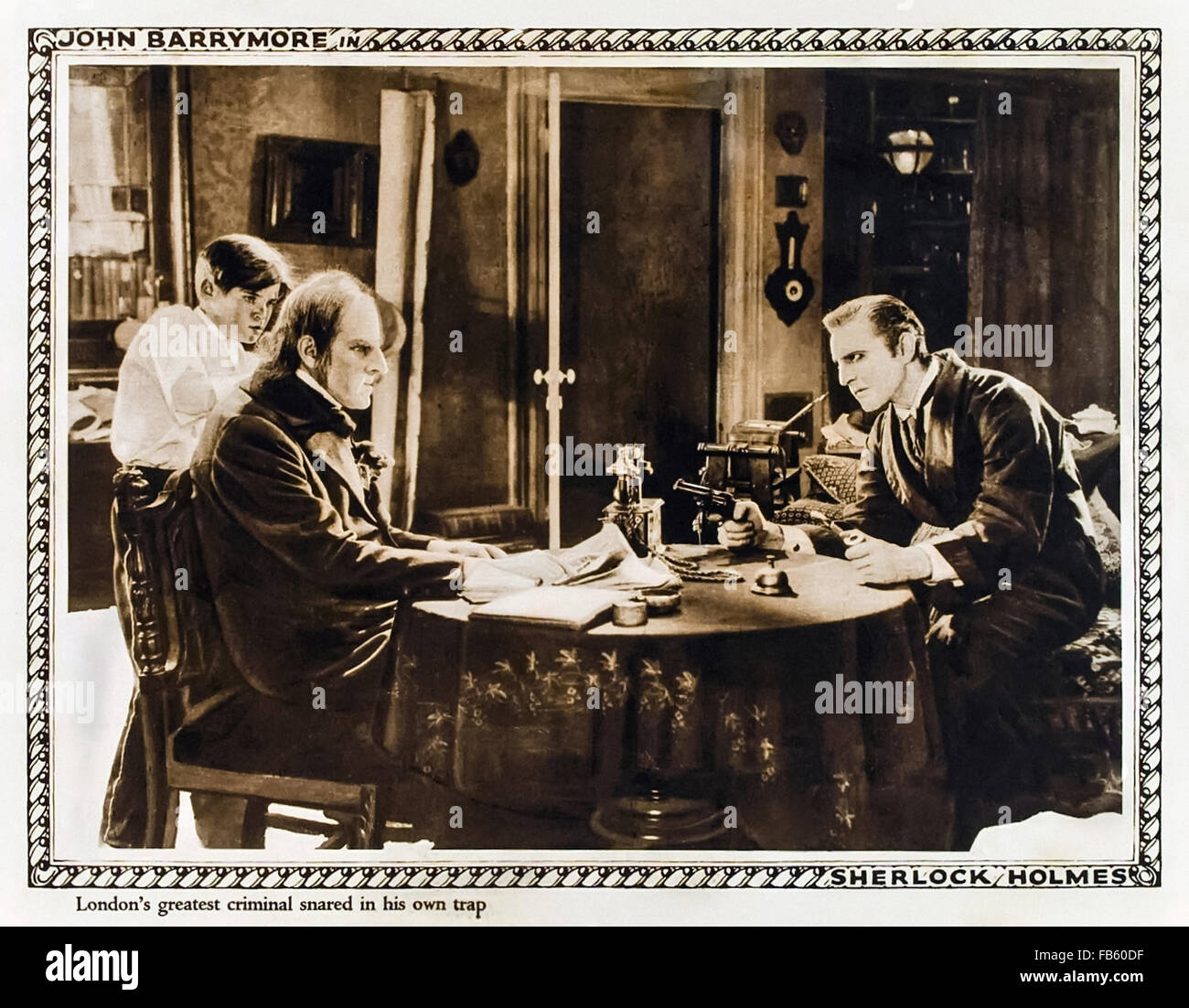 'London's greatest criminal snared in his own trap' Lobby card showing John Barrymore playing Sherlock Holmes and Gustav von Seyffertitz as Prof. Moriarty in the 1922 silent film 'Sherlock Holmes' (UK title 'Moriarty') directed by Albert Parker. Stock Photo