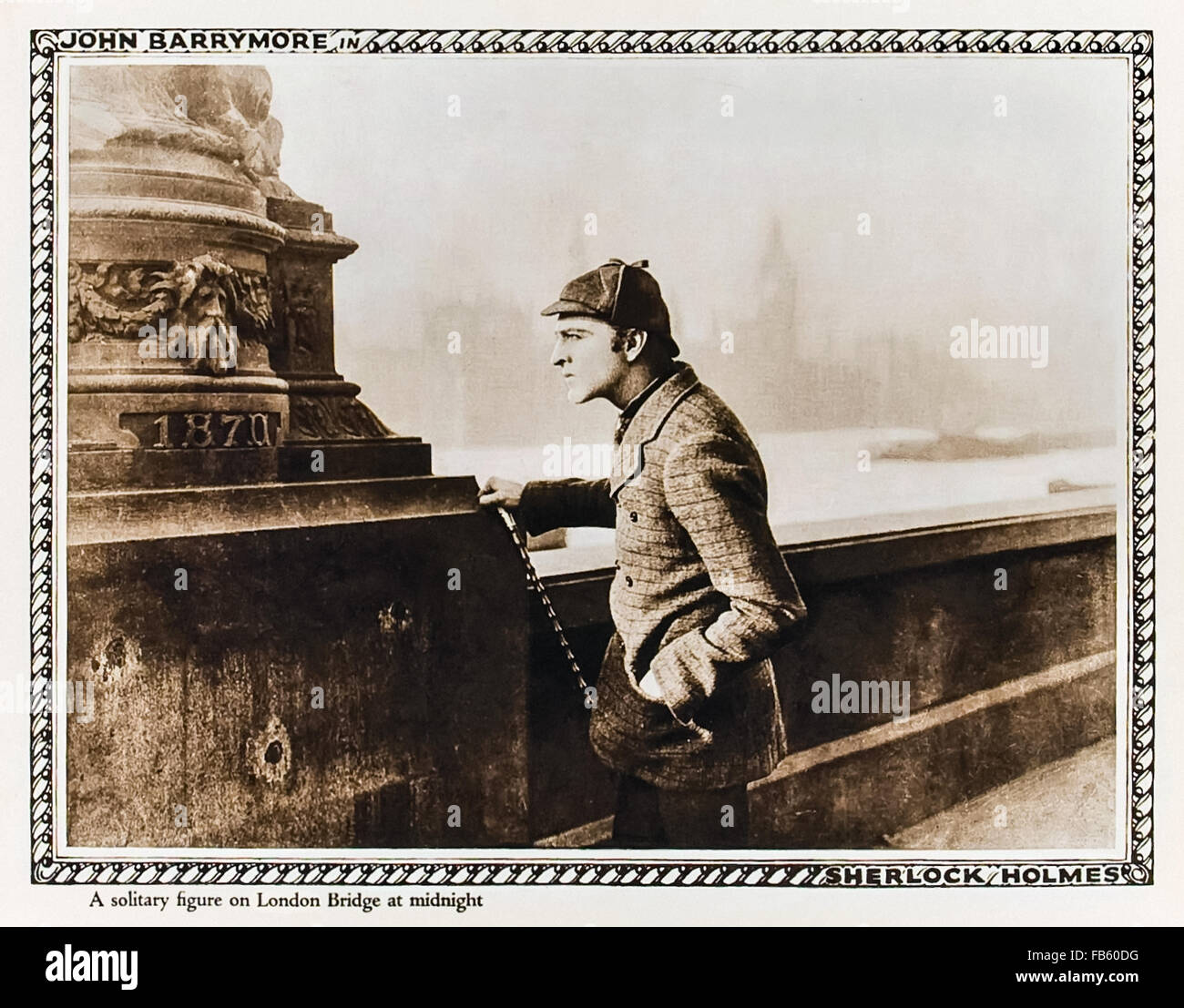 'A solitary figure on London Bridge at midnight' Lobby card showing John Barrymore playing Sherlock Holmes in the 1922 silent film 'Sherlock Holmes' (UK title 'Moriarty') directed by Albert Parker. See description for more information. Stock Photo