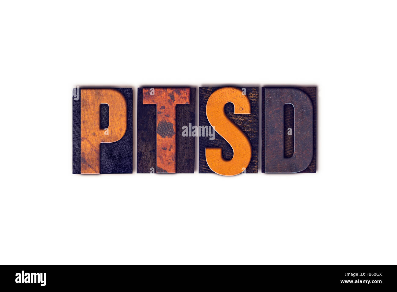 The word 'PTSD' written in isolated vintage wooden letterpress type on a white background. Stock Photo