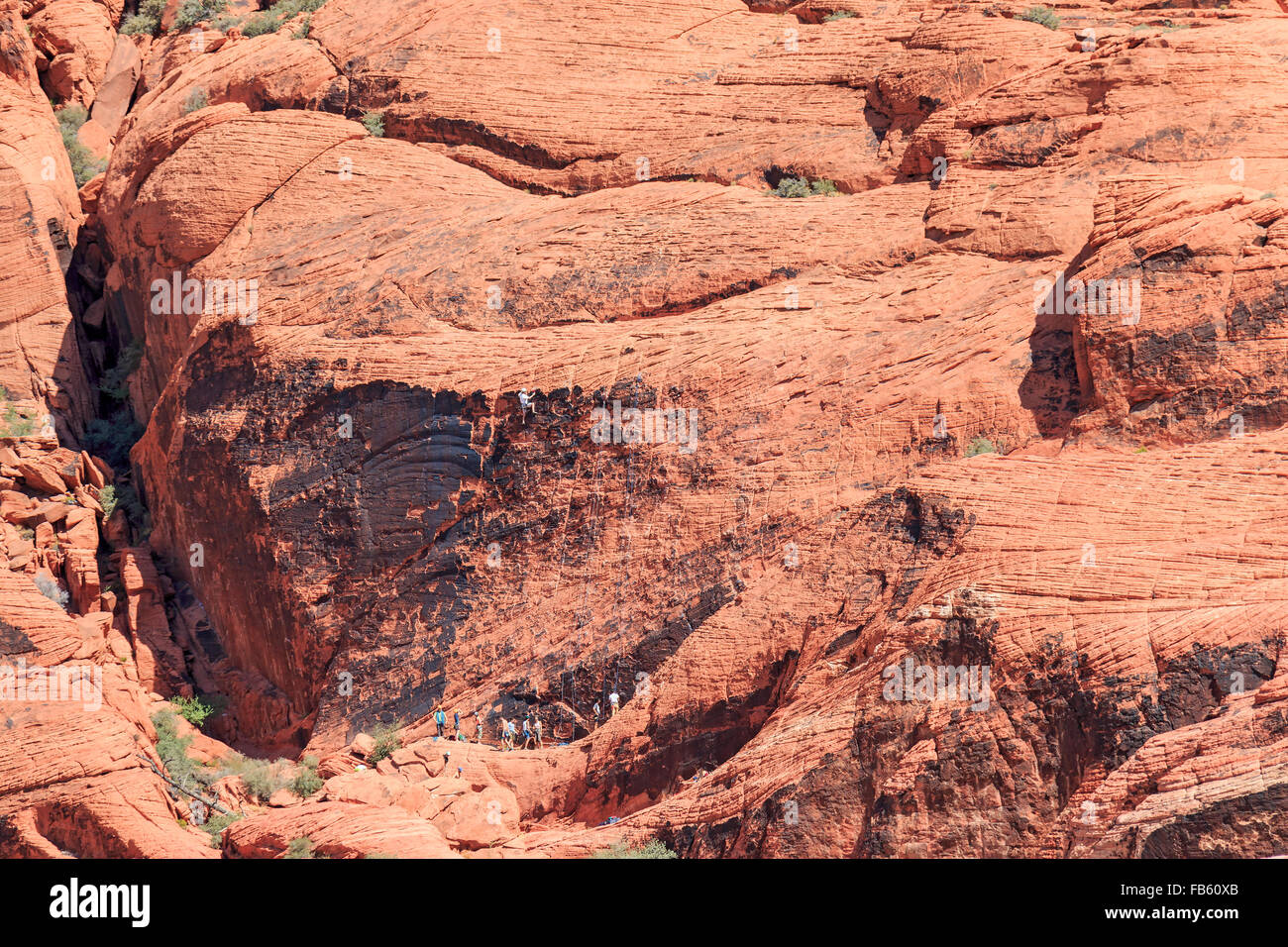 Climbers scale the red rock of Calico 1 area in the Calico Hills of Red ...