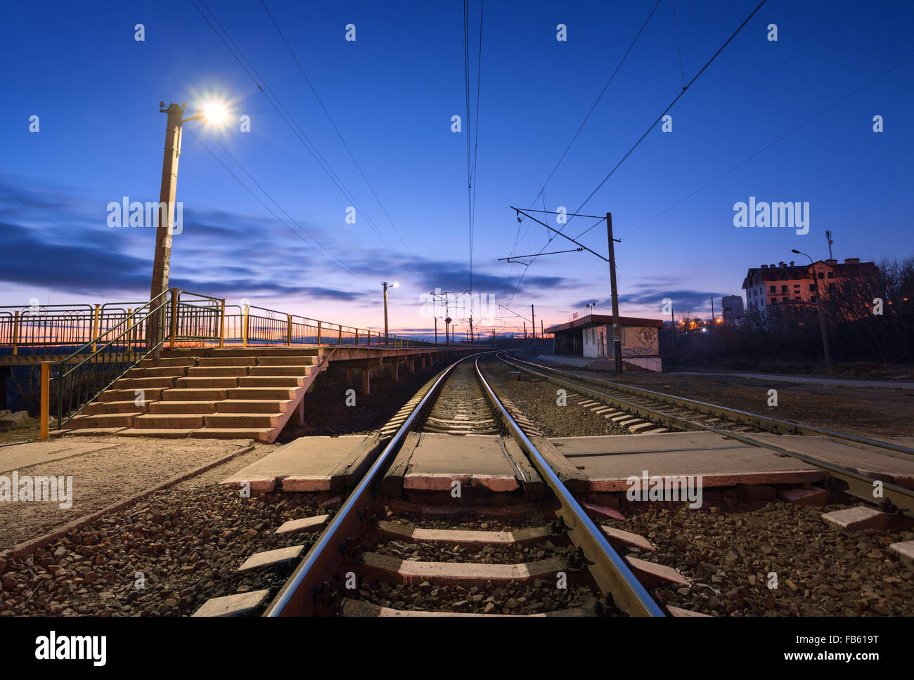 Railway station at night. Railroad in Ukraine. Stock Photo