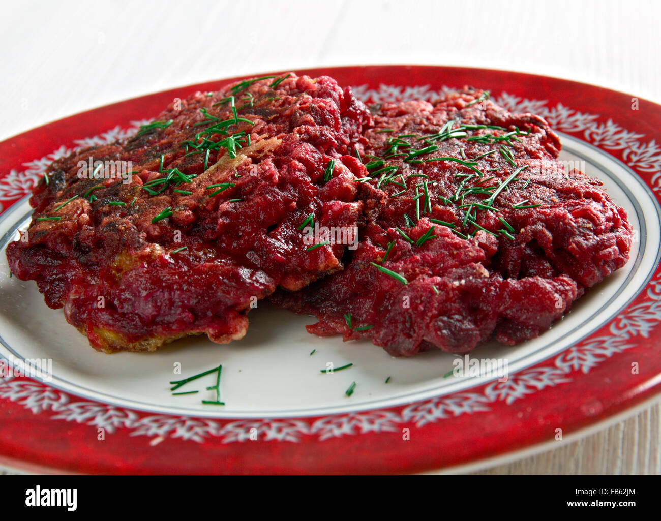Beet Fritters on a wooden surface. traditional  german cuisine Stock Photo