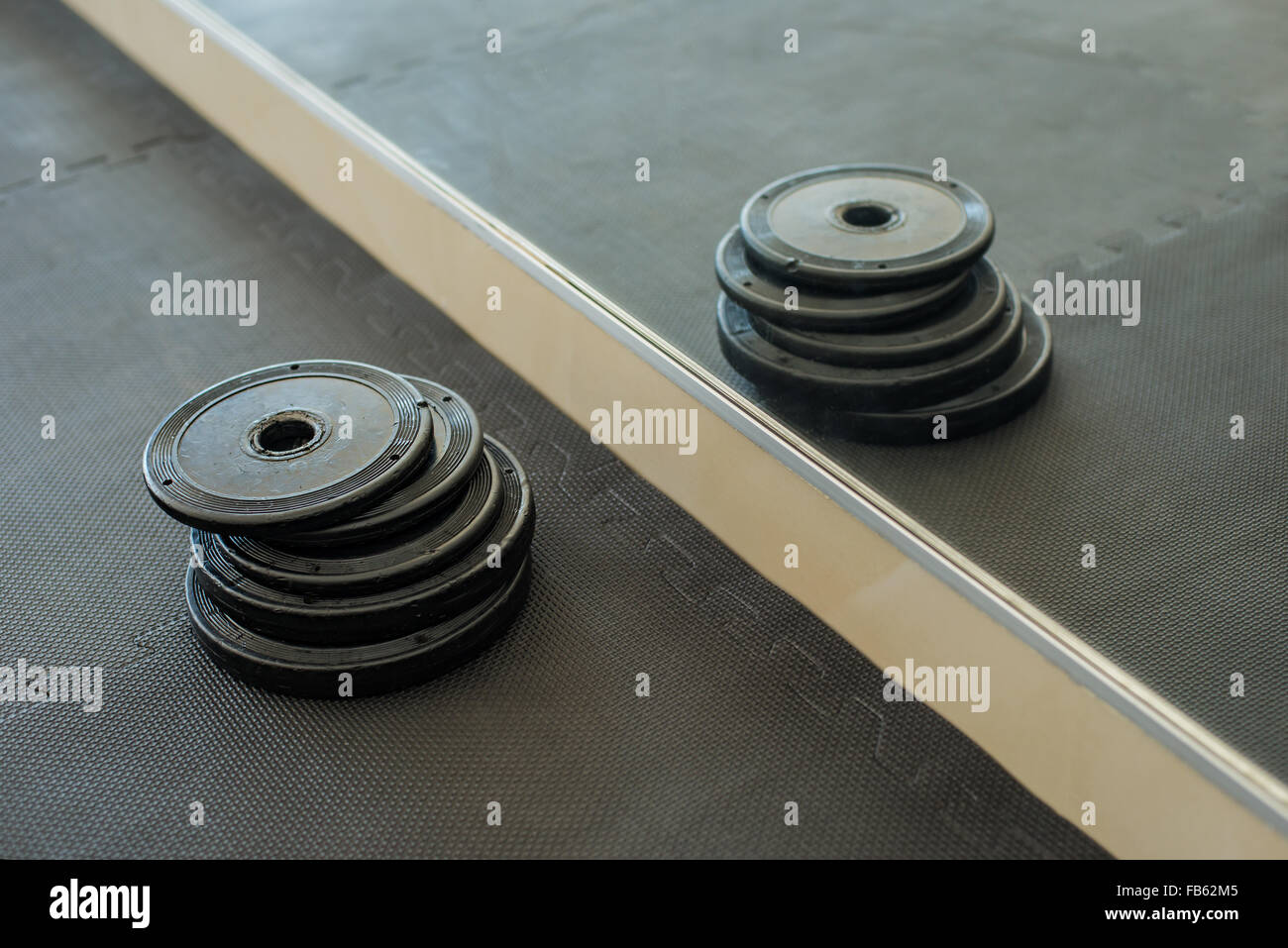 Barbells weight plate in gym Stock Photo Alamy