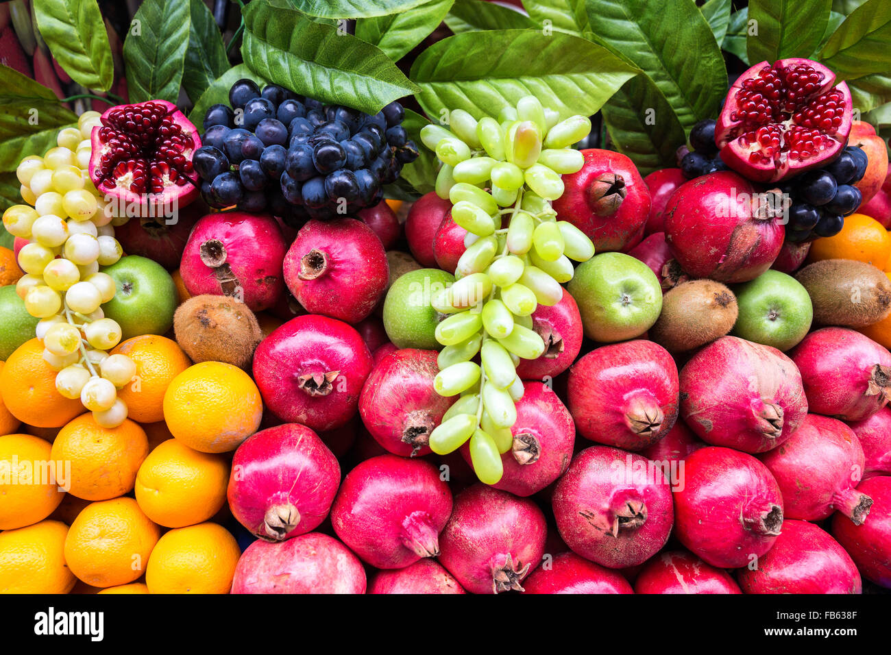 Many kind of different fruits on a showcase closeup view. Street vendor selling colorful exotic