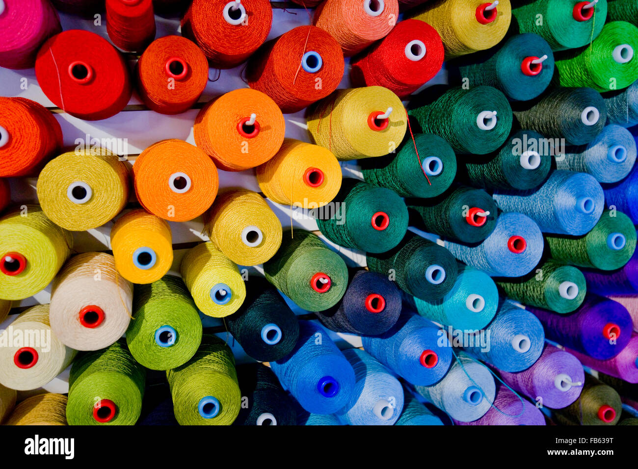 colorful thread on cone spools Stock Photo