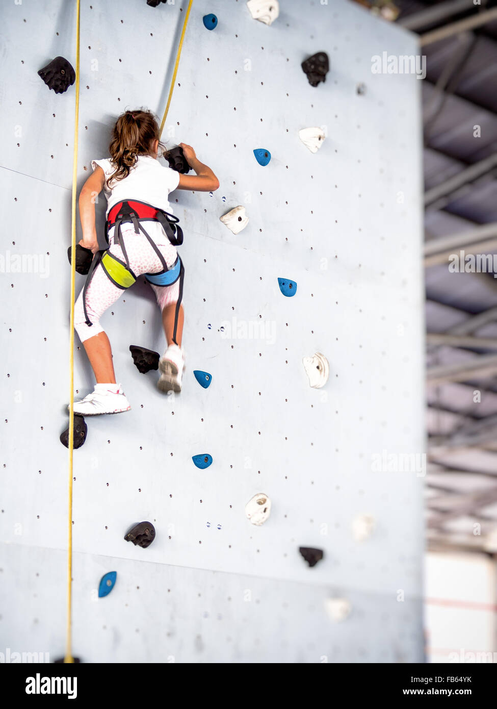 free climbing kids. Demonstration of training of indoor free climbing Stock Photo