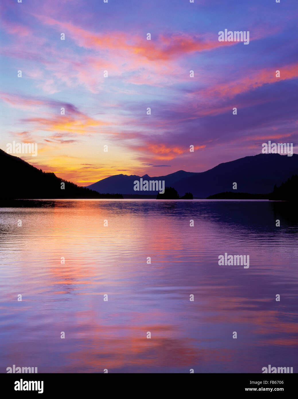 sunset over noxon reservoir and the mountains near noxon